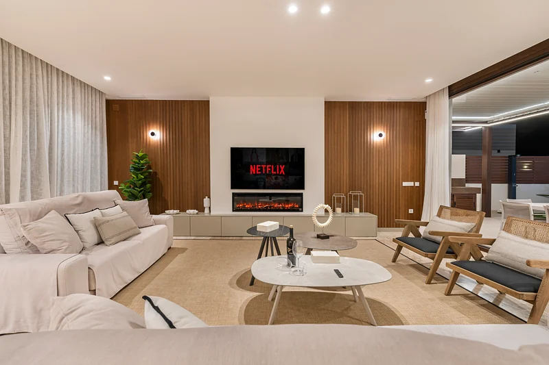 Living room with wooden wall and fireplace