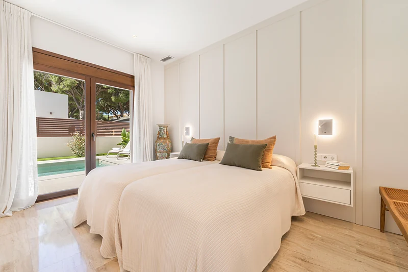 Bedroom with a view of the pool