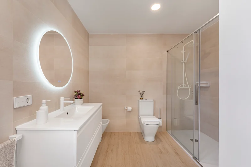 Bathroom with illuminated mirror