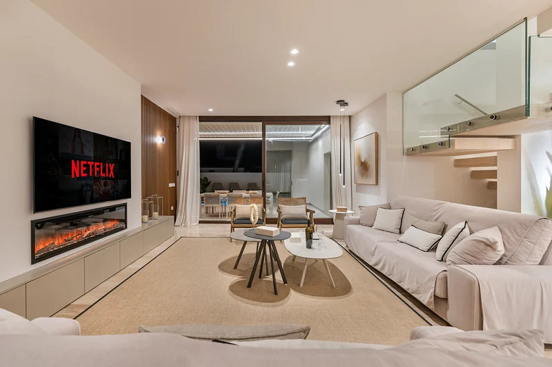 Living area with fireplace and staircase