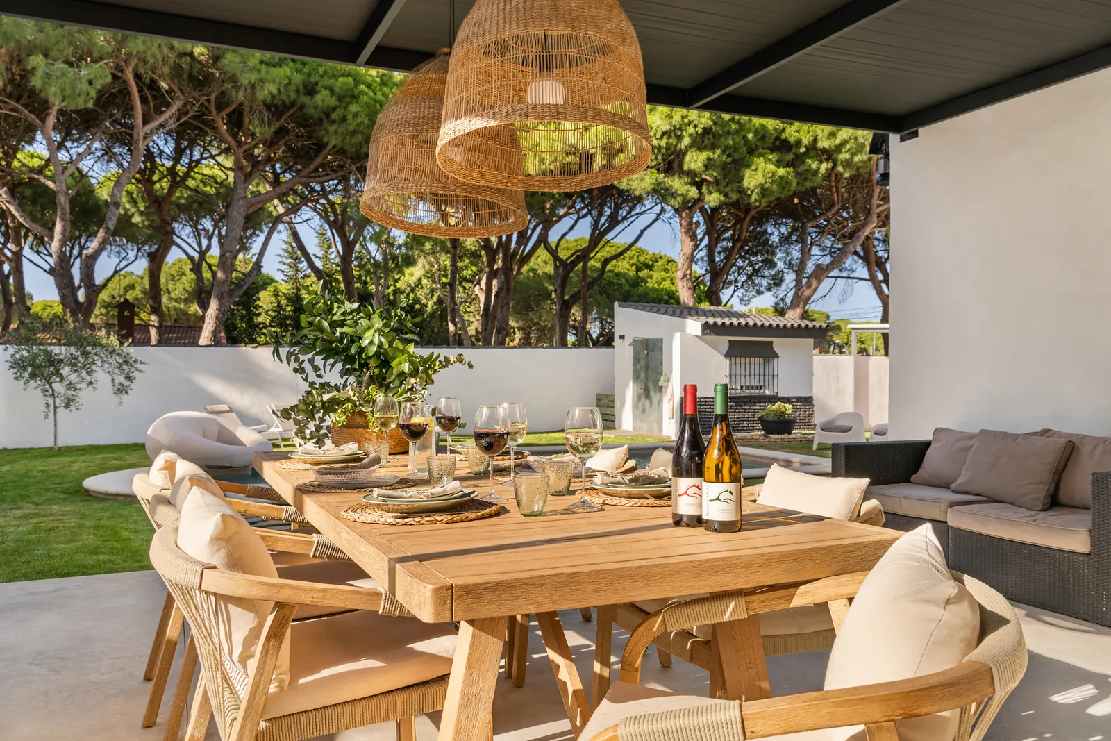 Wooden table set under the pergola