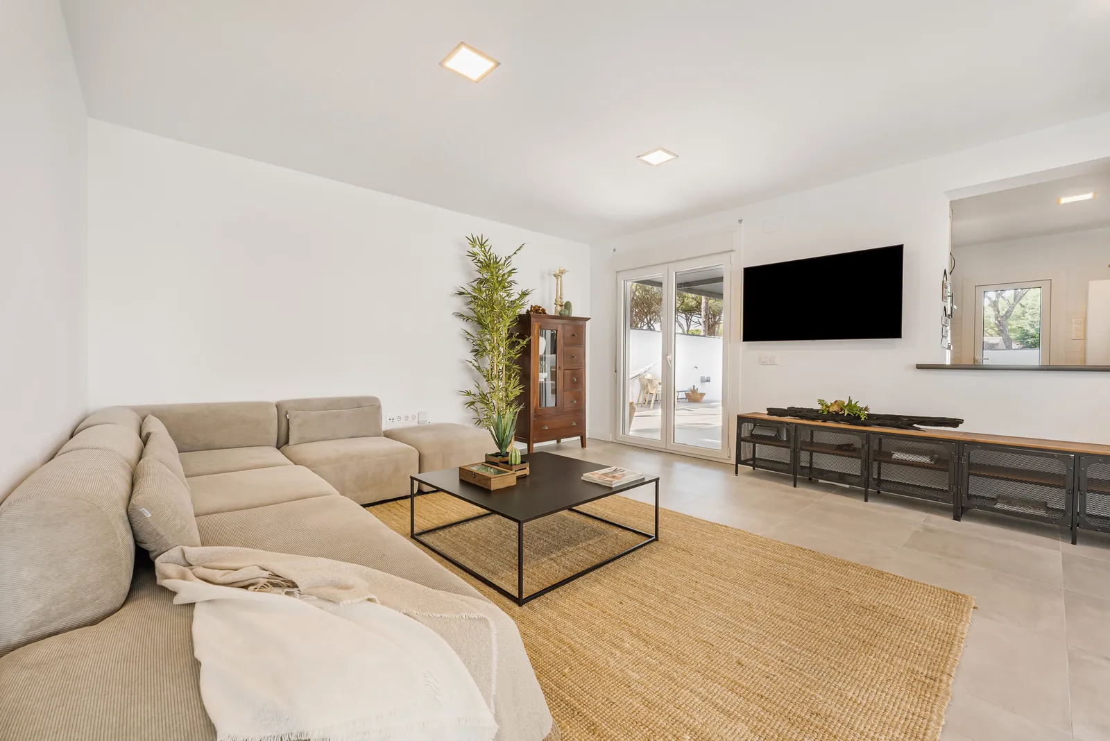 Living room with sofa and large windows